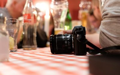 cropped-image-person-with-camera-restaurant (1)